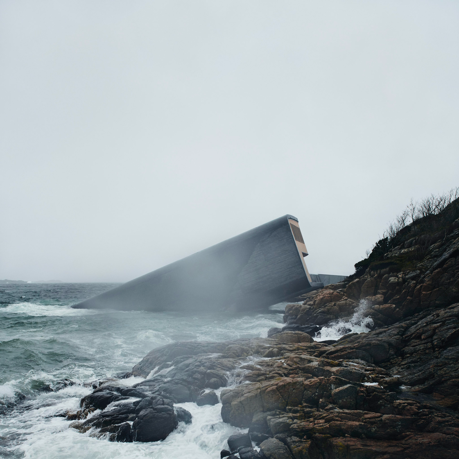 Under restaurant exterior, half-submerged on the Norwegian coast